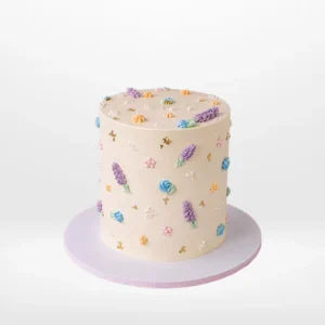 Spring cake with pastel flowers and butterfly decorations from Cake Shop Birmingham.