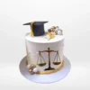 Law graduation cake with books and scales of justice from Cake Shop Walsall.