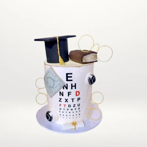 Optometry graduation cake with eye chart, glasses, and graduation cap from Cake Shop Walsall.