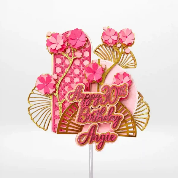 Personalised birthday cake topper with layered 3D design, flowers, and gold accents from Cake Shop Birmingham.