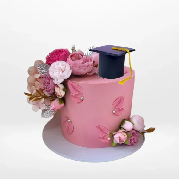 Pink graduation cake with elegant decorations from Cake Shop Walsall.