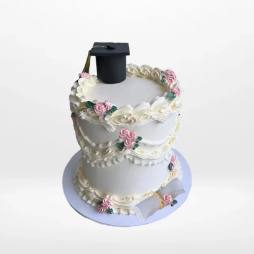 Vintage graduation cake with pink flowers and gold accents from Cake Shop Birmingham.